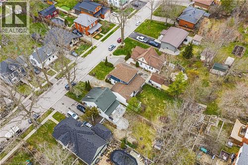 Aerial view of the property and surrounding neighborhood, featuring residential homes with various roof styles and established trees - 30 Grand Avenue, Caledonia, ON 