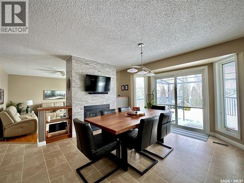 140 Morrison Drive, Yorkton, SK - Indoor Photo Showing Dining Room With Fireplace