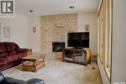 802 7Th Street E, Saskatoon, SK - Indoor Photo Showing Living Room With Fireplace