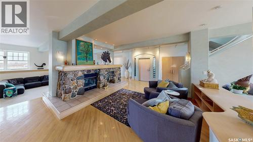 400 1150 Rose Street, Regina, SK - Indoor Photo Showing Living Room With Fireplace