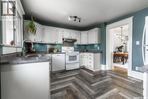 215 27Th Street W, Saskatoon, SK - Indoor Photo Showing Kitchen With Double Sink