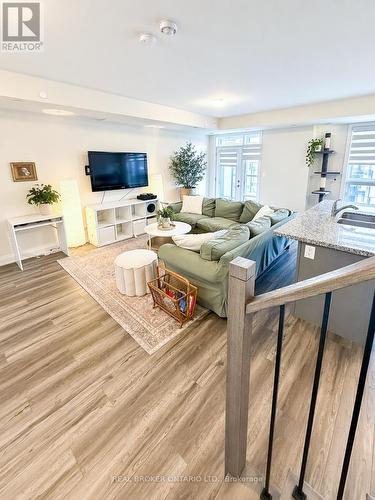 110 - 1593 Rose Way, Milton, ON - Indoor Photo Showing Living Room