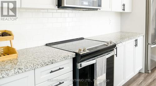 110 - 1593 Rose Way, Milton, ON - Indoor Photo Showing Kitchen With Upgraded Kitchen