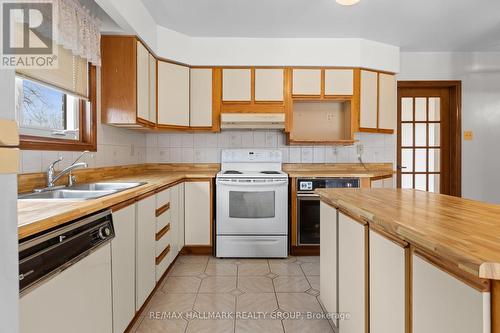 Kitchen with a central island, generous prep space - 1310 Ferguson Street, Ottawa, ON - Indoor Photo Showing Kitchen With Double Sink