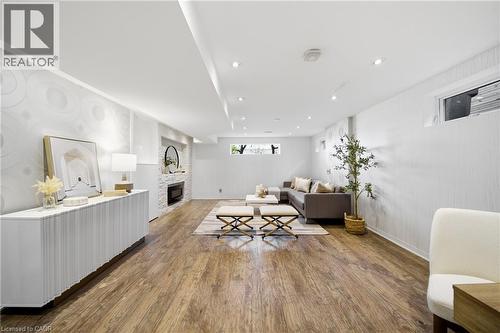 The spacious living area features wood-style flooring and recessed lighting - 2467 Bonner Road, Mississauga, ON - Indoor