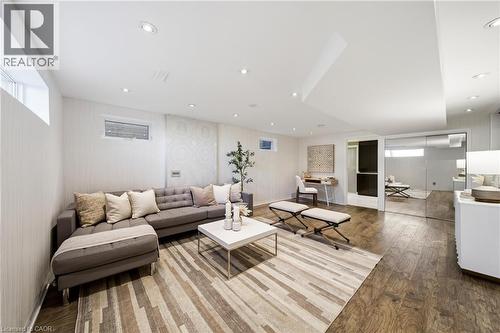 Living area featuring wood flooring, recessed lighting, and a window providing natural light - 2467 Bonner Road, Mississauga, ON - Indoor Photo Showing Living Room