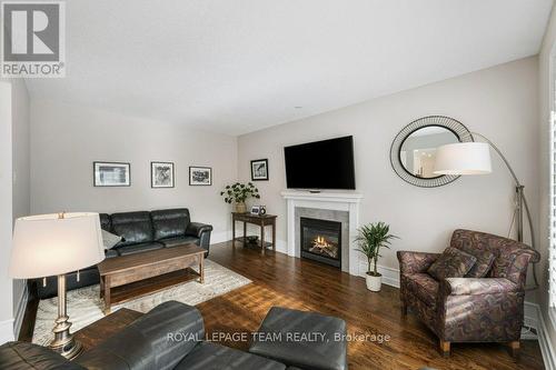 8 Thunderbird Crescent, Ottawa, ON - Indoor Photo Showing Living Room With Fireplace