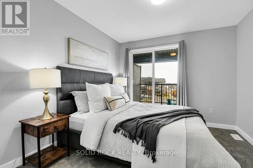 Primary bedroom w/ walk-in closet+covered balcony - 512 Pilot Private, Ottawa, ON - Indoor Photo Showing Bedroom