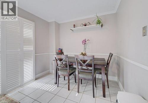 This room features white tile flooring, white crown molding, and white baseboards - 334 Christopher Drive, Cambridge, ON - Indoor Photo Showing Dining Room