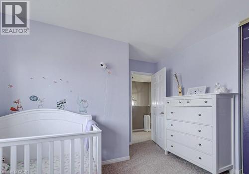 This room features light purple walls and neutral-toned carpeting, creating a calming atmosphere - 334 Christopher Drive, Cambridge, ON - Indoor Photo Showing Other Room