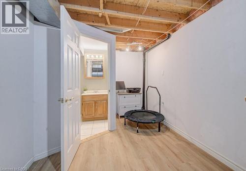 This area features light-colored flooring and white walls, with an exposed ceiling - 334 Christopher Drive, Cambridge, ON - Indoor Photo Showing Other Room