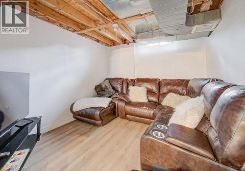This versatile space features light-toned flooring and white walls, offering a bright and adaptable environment - 334 Christopher Drive, Cambridge, ON - Indoor Photo Showing Basement