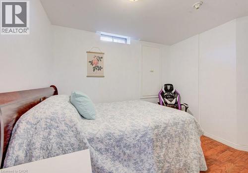 Bright room with white walls, a small window, and wood flooring - 334 Christopher Drive, Cambridge, ON - Indoor Photo Showing Bedroom