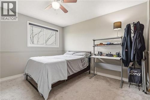 This room features a window providing natural light, a ceiling fan, and carpeted flooring - 2349 Middlesmoor Crescent, Burlington, ON - Indoor Photo Showing Bedroom