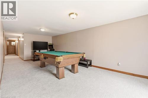 This spacious recreational area features neutral wall tones, light-colored carpeting, and a recessed ceiling with flush mount lighting - 2349 Middlesmoor Crescent, Burlington, ON - Indoor Photo Showing Other Room