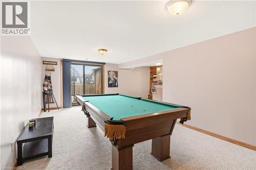 Recreation room featuring a pool table, light-colored carpet, and a glass sliding door providing outdoor access - 2349 Middlesmoor Crescent, Burlington, ON - Indoor Photo Showing Other Room
