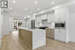 Kitchen. Photo is of a similar home in the community - 