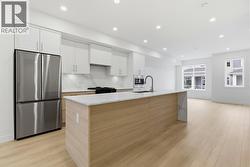 Kitchen. Photo is of a similar home in the community - 