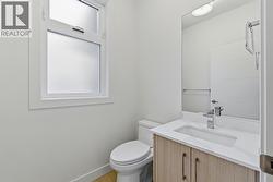 Main Level Bathroom. Photo is of a similar home in the community - 