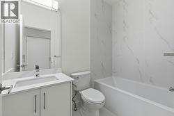 Upper Level Bathroom. Photo is of a similar home in the community - 