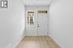 Lower Level Foyer. Photo is of a similar home in the community - 