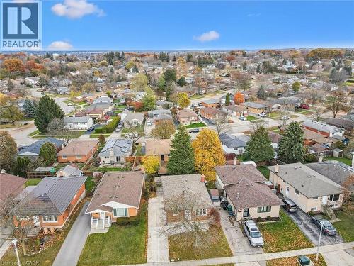 Aerial view of a residential area featuring numerous properties with varied roof styles and surrounding trees - 217 Johanna Drive, Cambridge, ON - Outdoor With View