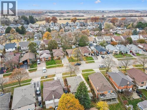 Aerial view of the neighbourhood, showcasing several residential properties with varied rooflines and surrounding trees - 217 Johanna Drive, Cambridge, ON - Outdoor With View