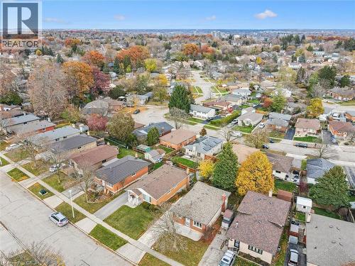 Aerial view showcasing a residential neighborhood with a variety of homes, mature trees, and well-maintained lawns - 217 Johanna Drive, Cambridge, ON - Outdoor With View