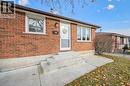 The property features a brick exterior with white trim windows and a white storm door - 217 Johanna Drive, Cambridge, ON  - Outdoor 
