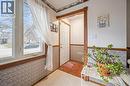 Entryway featuring a white door, patterned wainscoting, and large windows that provide natural light - 217 Johanna Drive, Cambridge, ON  - Indoor Photo Showing Other Room 
