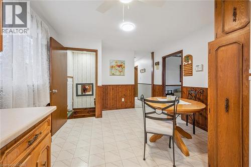 This room features white walls, wood paneling, and a tiled floor - 217 Johanna Drive, Cambridge, ON - Indoor