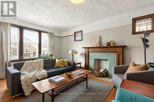 93 Houghton Avenue S, Hamilton, ON - Indoor Photo Showing Living Room With Fireplace
