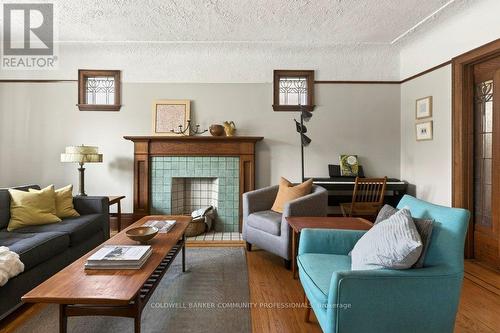 93 Houghton Avenue S, Hamilton, ON - Indoor Photo Showing Living Room With Fireplace