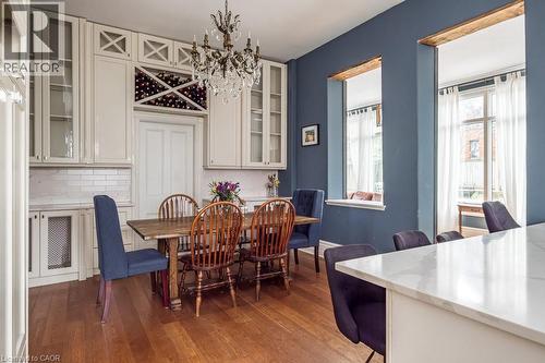Custom glass cabinets blend with cabinetry in the kitchen - 347 Queen Street S, Hamilton, ON - Indoor Photo Showing Dining Room