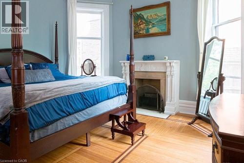 347 Queen Street S, Hamilton, ON - Indoor Photo Showing Bedroom With Fireplace