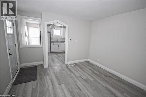 The property features light gray walls and wood-look flooring - 1356 Upper Wellington Street, Hamilton, ON - Indoor Photo Showing Other Room