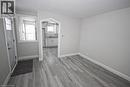 The property features light gray walls and wood-look flooring - 1356 Upper Wellington Street, Hamilton, ON  - Indoor Photo Showing Other Room 