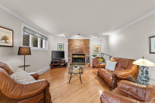 Salon - 889 Rue Des Érables, Saint-Eustache, QC - Indoor Photo Showing Living Room With Fireplace