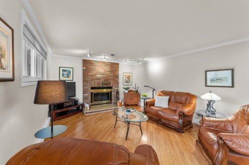 Salon - 889 Rue Des Érables, Saint-Eustache, QC - Indoor Photo Showing Living Room With Fireplace