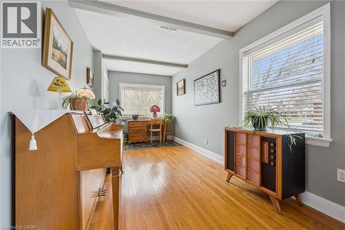The room features hardwood flooring, light grey walls, and two large windows with blinds - 155 Hungerford Road, Cambridge, ON - Indoor Photo Showing Office