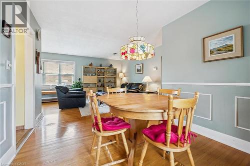 Dining area with hardwood floors and a decorative ceiling light fixture - 155 Hungerford Road, Cambridge, ON - Indoor Photo Showing Dining Room