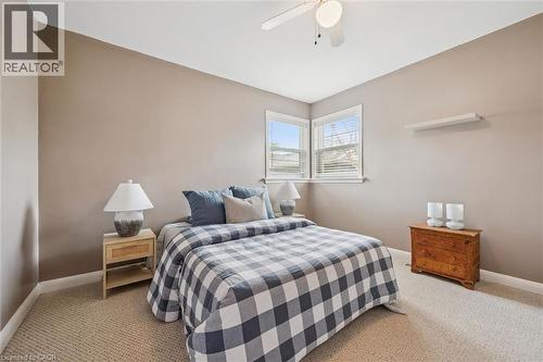 This room features carpeting, a ceiling fan, and windows with blinds - 155 Hungerford Road, Cambridge, ON - Indoor Photo Showing Bedroom