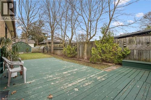 The property features a spacious backyard with a deck, a fenced perimeter, and a shed - 155 Hungerford Road, Cambridge, ON - Outdoor