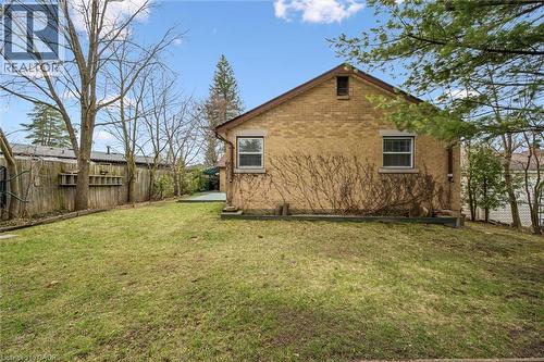 The property features a brick exterior with a pitched roof and multiple windows - 155 Hungerford Road, Cambridge, ON - Outdoor