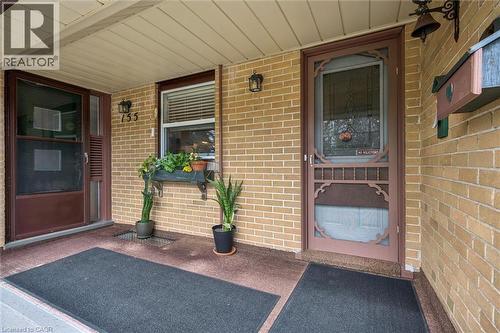 The property features a brick exterior with a covered entryway - 155 Hungerford Road, Cambridge, ON - Outdoor With Exterior