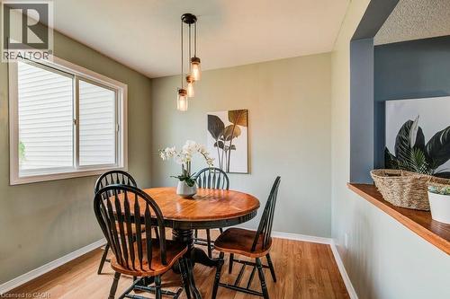Dining area featuring light wood-style floors and baseboards - 633 Grange Crescent, Waterloo, ON - Indoor Photo Showing Dining Room