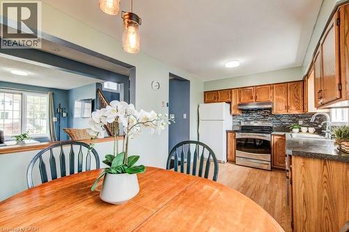 Dining space with light wood-type flooring - 633 Grange Crescent, Waterloo, ON - Indoor
