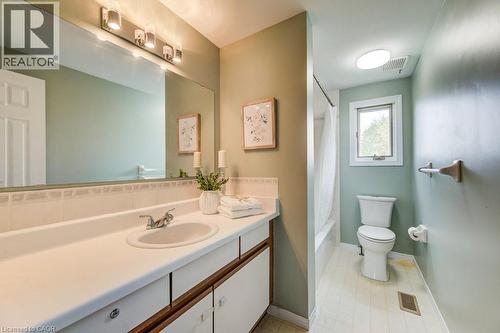 Full bathroom featuring vanity and shower / bathtub combination with curtain - 633 Grange Crescent, Waterloo, ON - Indoor Photo Showing Bathroom
