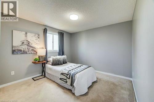 Bedroom with light colored carpet and a textured ceiling - 633 Grange Crescent, Waterloo, ON - Indoor Photo Showing Bedroom