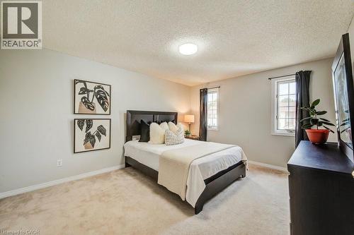 Bedroom with light colored carpet and a textured ceiling - 633 Grange Crescent, Waterloo, ON - Indoor Photo Showing Bedroom